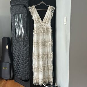 Beautiful white and gold floral dress with deep-V in back and front.